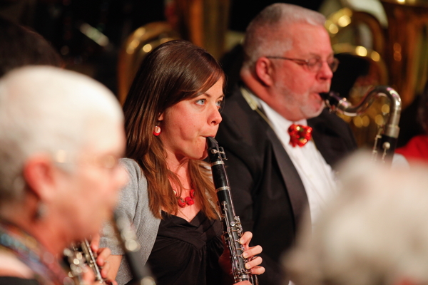 two women playing clarinet, man playing bass clarinet