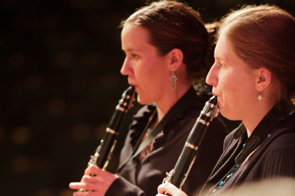 two women playing clarinet