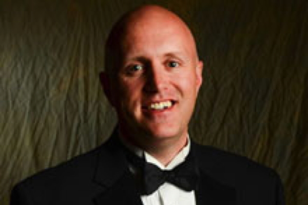 man in black tux, white shirt and bow tie