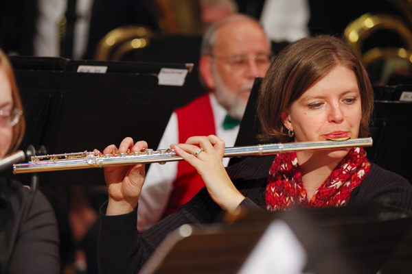 flute player with red patterned scarf