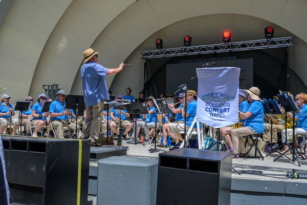 band playing inside a band shell