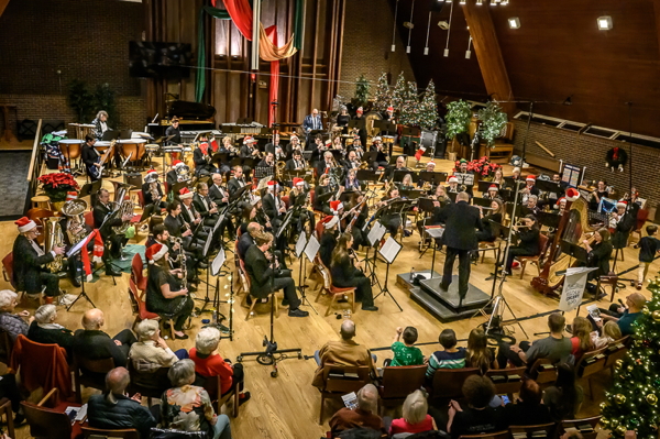 high-angle view of the band wearing red and white Santa hats