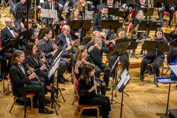 side view of the band, showing flute and clarinet players